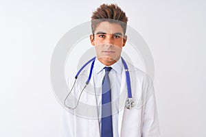 Young handsome doctor man wearing stethoscope over isolated white background depressed and worry for distress, crying angry and