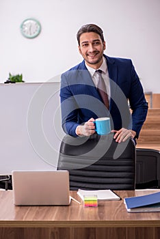 Young handsome employer in teleconference concept