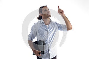 Young handsome guy holding laptop pointing upwards