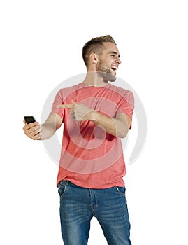 Young handsome guy laughing about something on his mobile phone