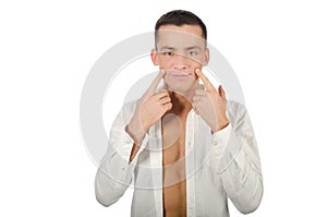 Young handsome guy smiling. Man posing in studio