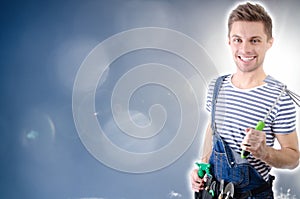 Young handsome handyman. White background.