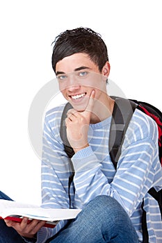 Young handsome happy male student with book