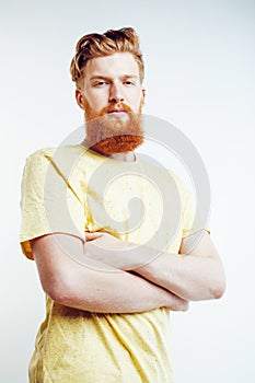 Young handsome hipster bearded guy looking brutal isolated on white background, lifestyle people concept