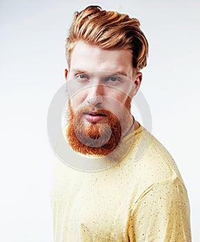 Young handsome hipster bearded guy looking brutal isolated on white background, lifestyle people concept