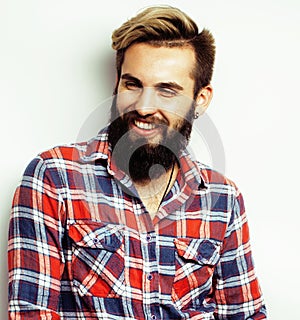 Young handsome hipster bearded guy looking brutal isolated on white background, lifestyle people concept