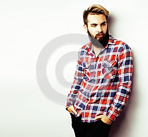 Young handsome hipster bearded guy looking brutal isolated on white background, lifestyle people concept