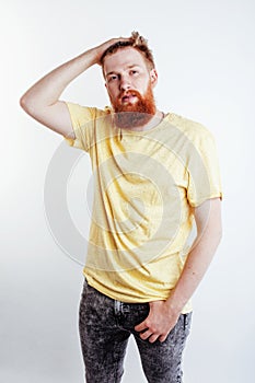 Young handsome hipster bearded guy looking brutal isolated on white background, lifestyle people concept