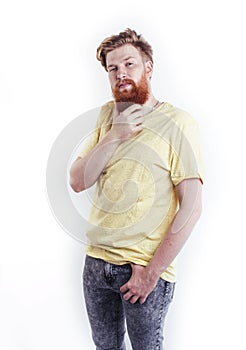 Young handsome hipster ginger bearded guy looking brutal isolated on white background, lifestyle people concept