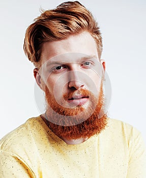 young handsome hipster ginger bearded guy looking brutal isolated on white background, lifestyle people concept
