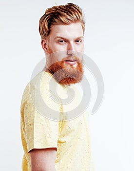 young handsome hipster ginger bearded guy looking brutal isolated on white background, lifestyle people concept