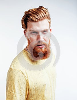Young handsome hipster ginger bearded guy looking brutal isolated on white background, lifestyle people concept