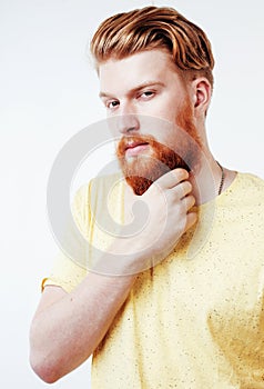 Young handsome hipster ginger bearded guy looking brutal isolated on white background, lifestyle people concept