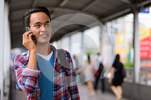 Young handsome Indian man exploring the city of Bangkok, Thailan