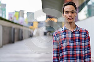 Young handsome Indian man exploring the city of Bangkok, Thailan