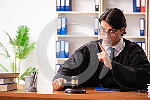 The young handsome judge working in court