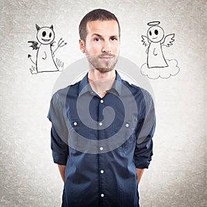 Young handsome man with angel and devil