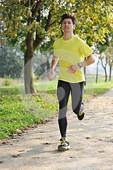 Young handsome man athlete running