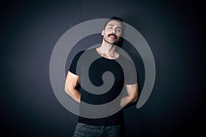 Young handsome man with beard and mustache studio portrait