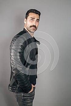 Young handsome man with beard and mustache studio portrait