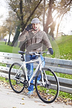 Young handsome man with a bicycle