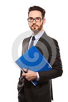 Young handsome man in black suit and glasses smiling isolated