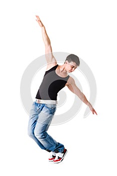 Young handsome man in blue jeans posing