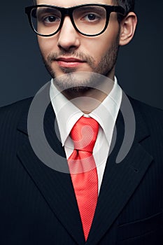 Young handsome man (businessman) in black suit