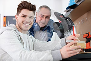 young handsome man during diy cours