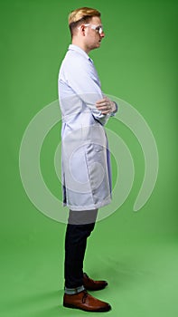 Young handsome man doctor with blond hair wearing protective gla