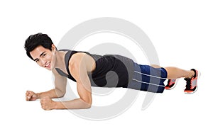 Young handsome man doing push up exercise