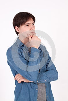 Young handsome man doubting isolated over gray background