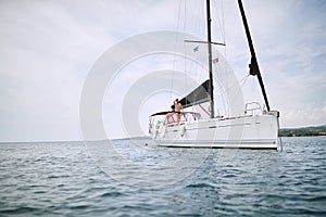 Young handsome man enjoying on a yacht