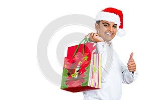 Young handsome man excited about christmas shopping