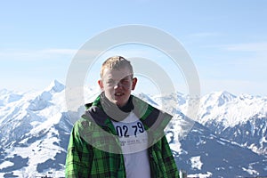 Young handsome man face. Zell am See, skiing resort in Alps.