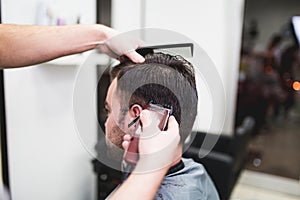 Young handsome man in hair salon