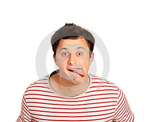 Young handsome man joke disagree gesture showing tongue. emotional guy isolated on white background