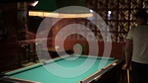 Young Handsome Man Playing Billiard In The Pub