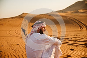 Young handsome man portrait on the desert