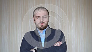 Young handsome man portrait of serious business entrepreneur looking serious pensive at camera