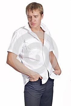 Young handsome man posing in white shirt