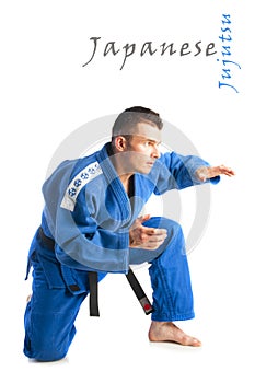Young handsome man practicing jiu-jitsu photo