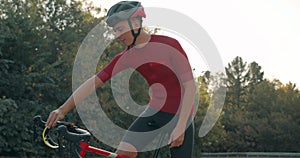 young handsome man Preparing for cycling triathlon competition.