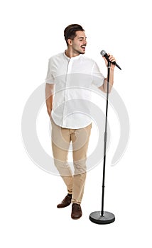 Young handsome man singing in microphone