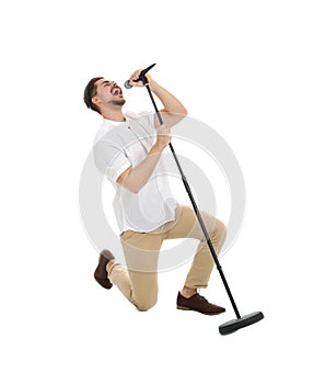 Young handsome man singing in microphone