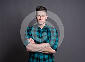 Young handsome man studio portrait, boy style