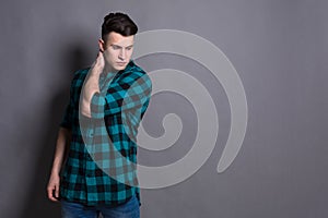 Young handsome man studio portrait, boy style