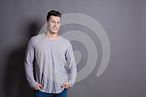 Young handsome man studio portrait, boy style