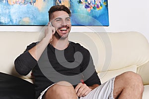 Young handsome man talking on the phone