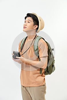 Young handsome man tourist with  camera in hands isolated